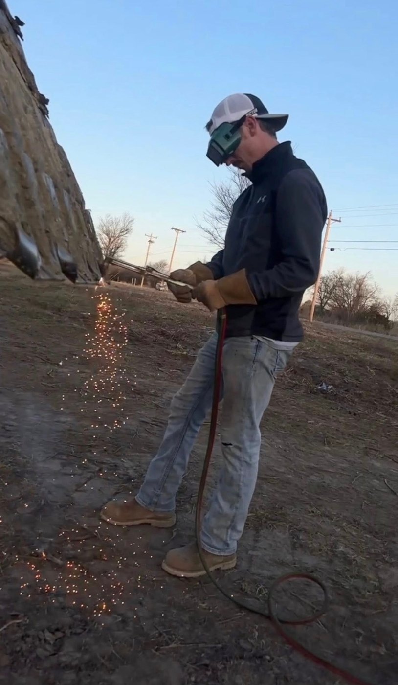 Sam cutting steel on site